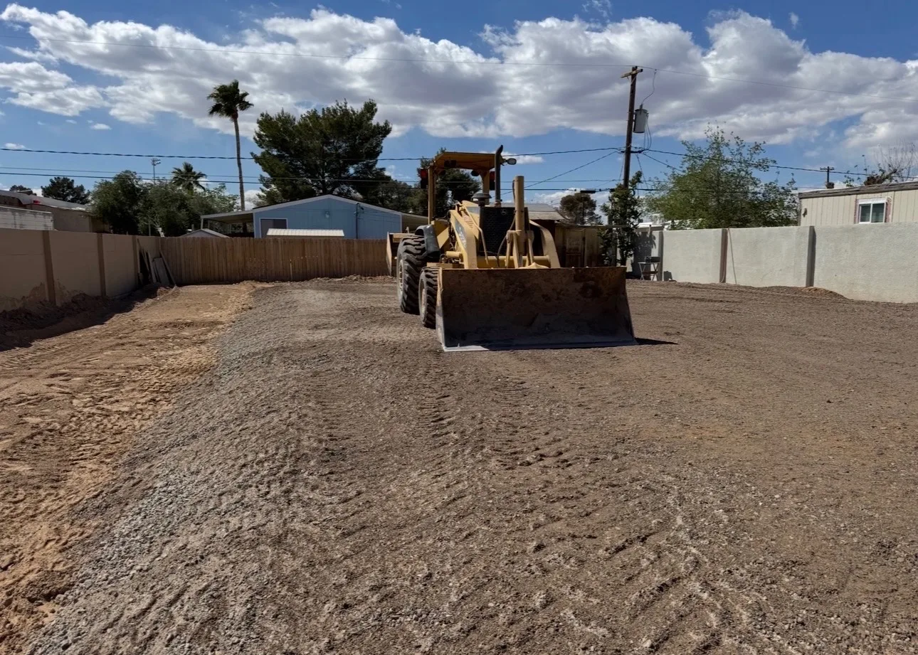 Wheel loader grading a residential lot to a smooth, compacted surface in Las Vegas